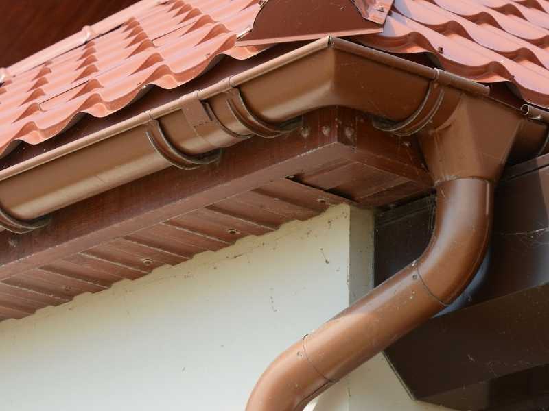 Copper gutters on red roof