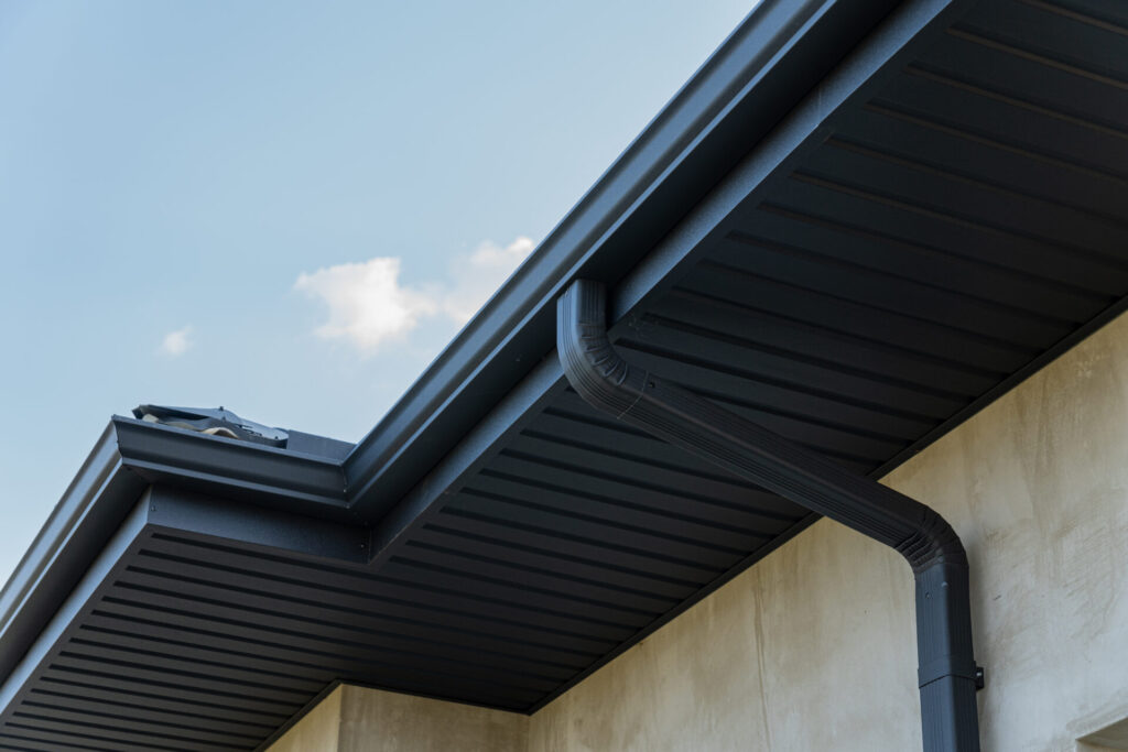 Gutter Installation on Miami home ready for monsoon rains with secure hangers and clear downspouts